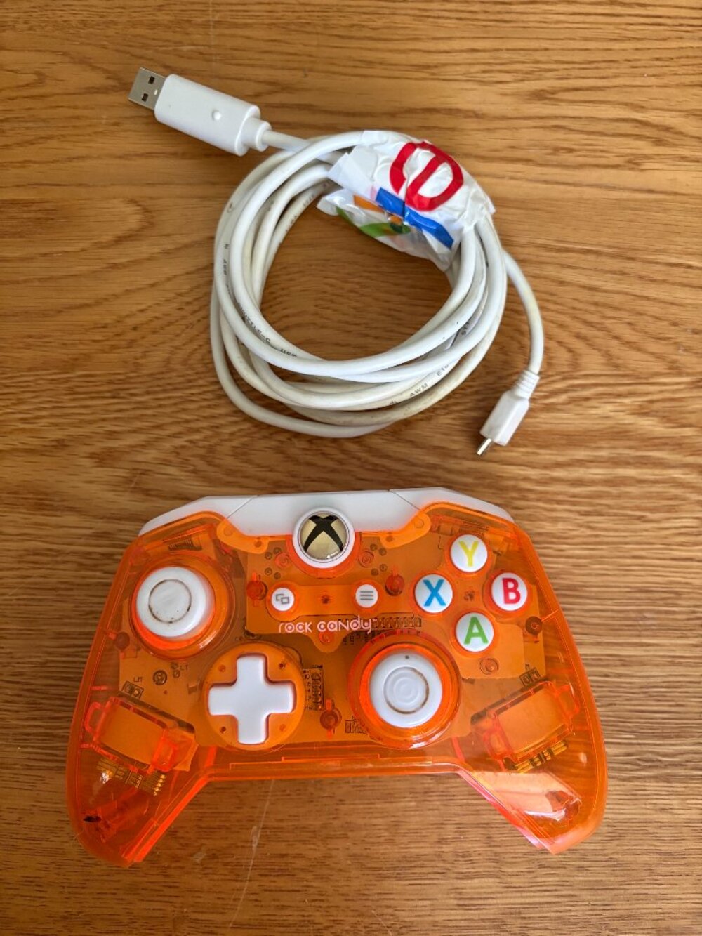 PDP Rock Candy Wired Controller for Xbox One in the "Atomic Tang"